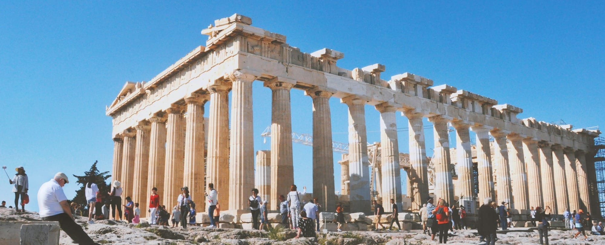 people near ancient structure during daytime